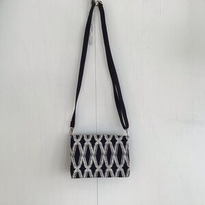 Thirtyone black and white cotton crossbody bag.